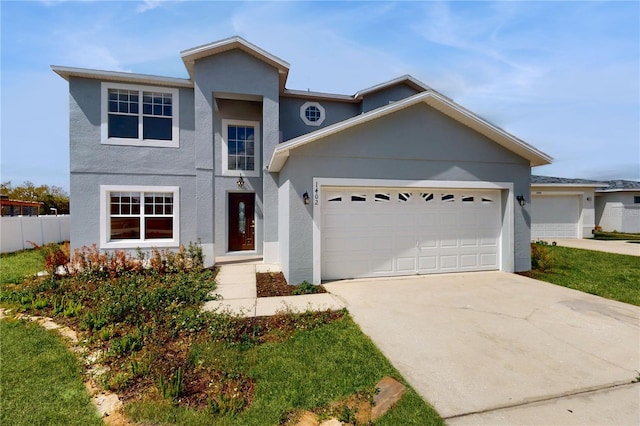 1402 Missouri Pl, Poinciana, FL 34759 - traditional-style home featuring driveway, an attached garage, and stucco siding