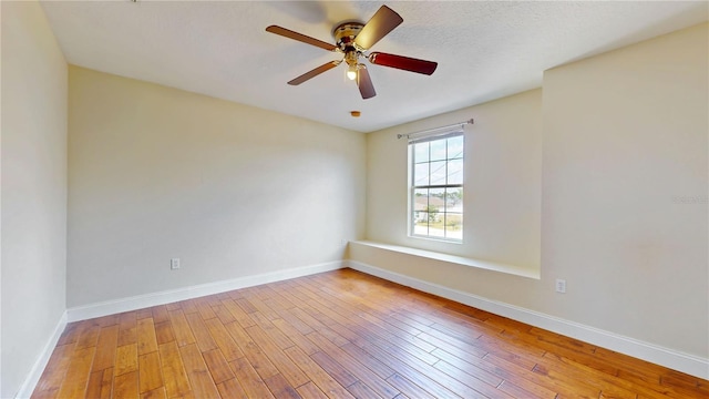 1402 Missouri Pl, Poinciana, FL 34759 - spare room with wood-type flooring, ceiling fan, and baseboards
