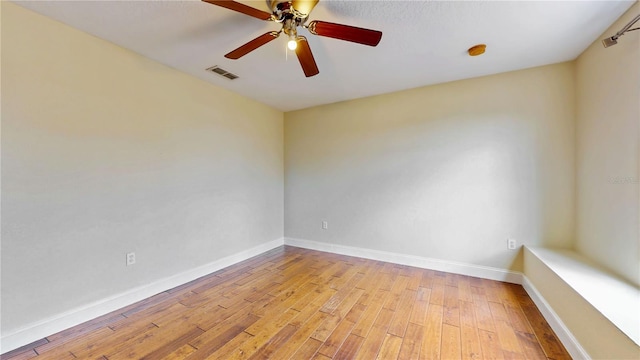 1402 Missouri Pl, Poinciana, FL 34759 - spare room with light wood-type flooring, ceiling fan, baseboards, and a smoke detector