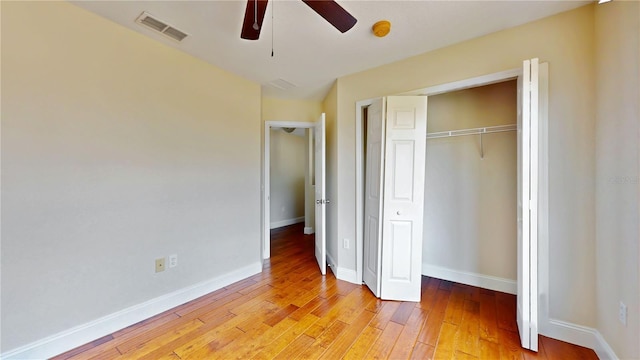 1402 Missouri Pl, Poinciana, FL 34759 - unfurnished bedroom with light wood-style flooring, a closet, baseboards, and ceiling fan