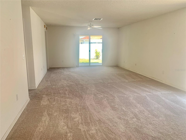 1324 Balboa Ct, The Villages, FL 32159 - empty room featuring a ceiling fan, a textured ceiling, baseboards, light colored carpet, and visible vents