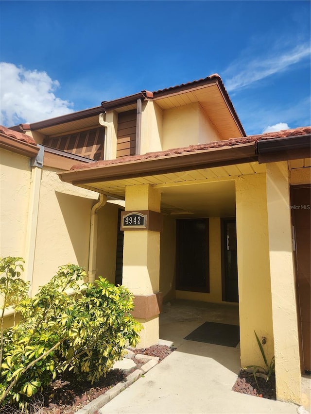 4942 Samoa Cir Unit 5, Orlando, FL 32808 - doorway to property with stucco siding