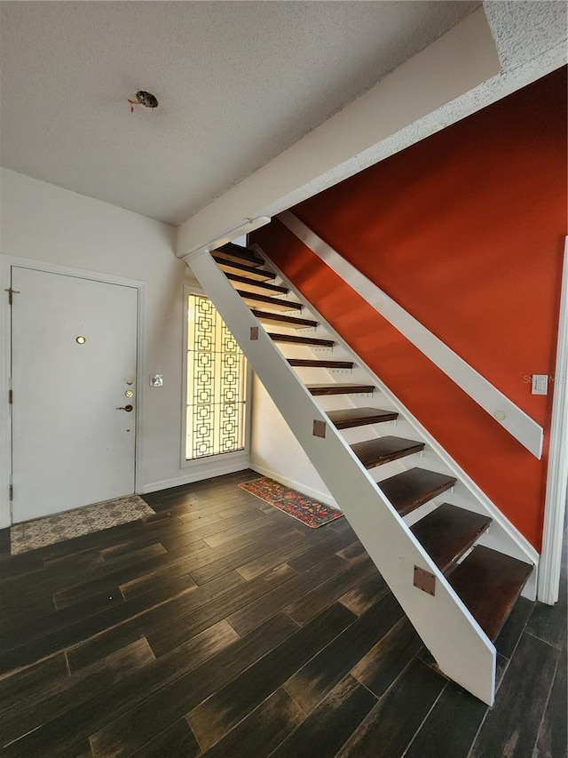 4942 Samoa Cir Unit 5, Orlando, FL 32808 - entryway featuring baseboards, stairs, a textured ceiling, and wood finished floors