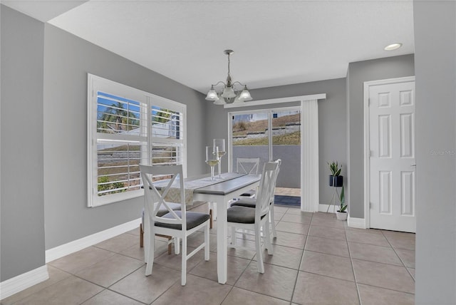 1510 Pier St, Clermont, FL 34711 - dining space with a healthy amount of sunlight, baseboards, and a notable chandelier