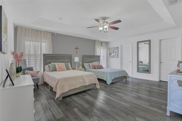 1510 Pier St, Clermont, FL 34711 - bedroom featuring a ceiling fan, visible vents, wood finished floors, and a tray ceiling