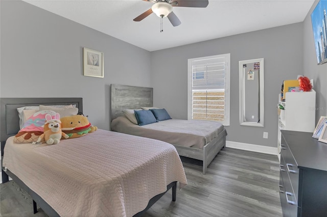 1510 Pier St, Clermont, FL 34711 - bedroom featuring baseboards, wood finished floors, ceiling fan, and multiple windows