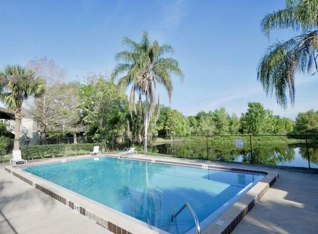 community pool featuring fence