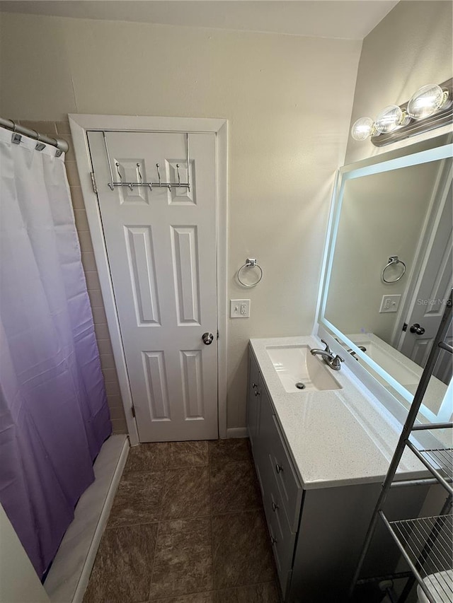 full bathroom with a shower with curtain and vanity