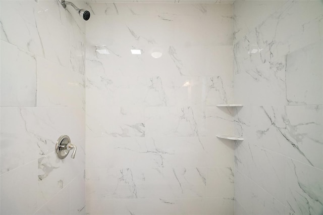full bathroom with tiled shower