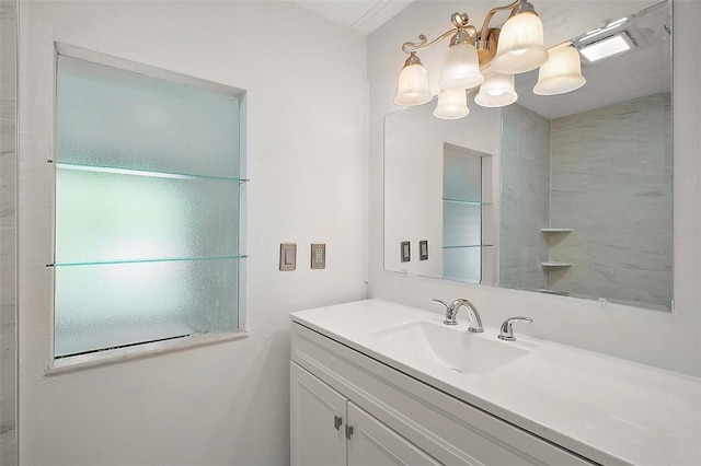 bathroom with a chandelier and vanity