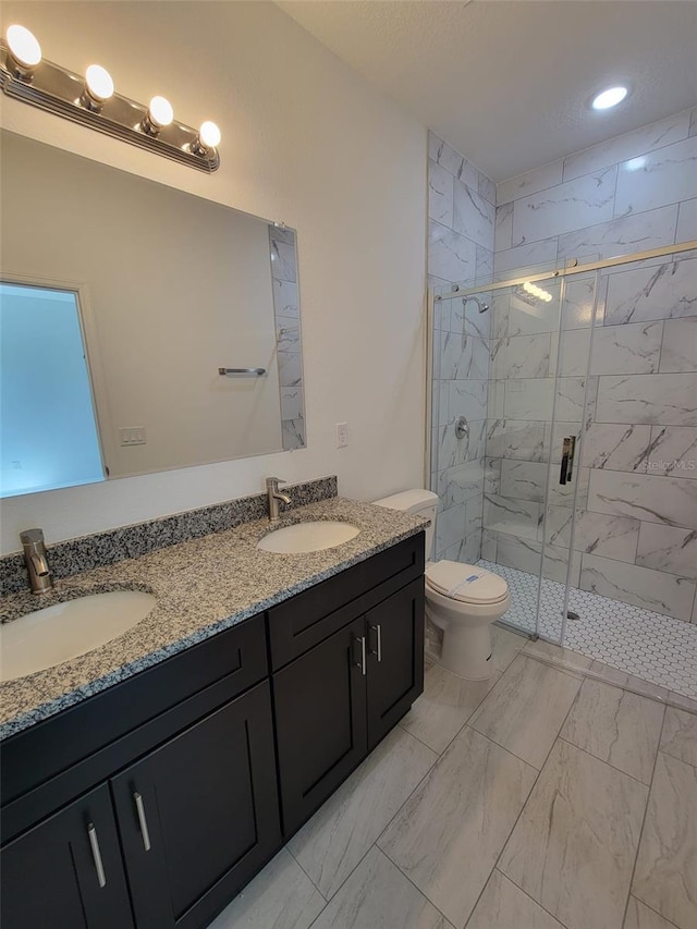 full bath featuring marble finish floor, toilet, a sink, and a marble finish shower