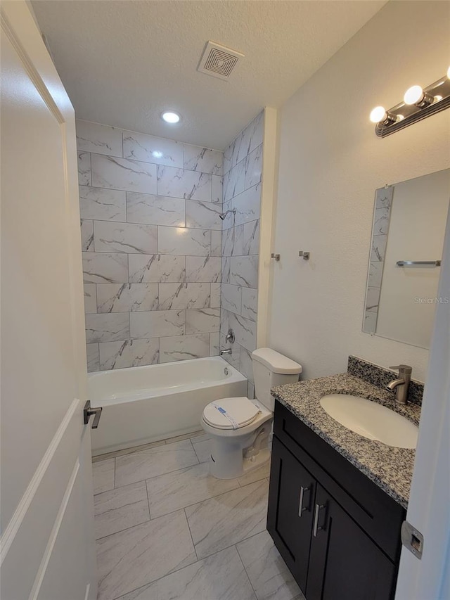 bathroom featuring visible vents, marble finish floor, toilet, vanity, and shower / washtub combination