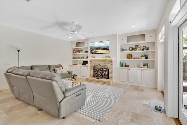 1560 Woodland Ave, Winter Park, FL 32789 - living room featuring ceiling fan, built in shelves, stone finish floor, and recessed lighting