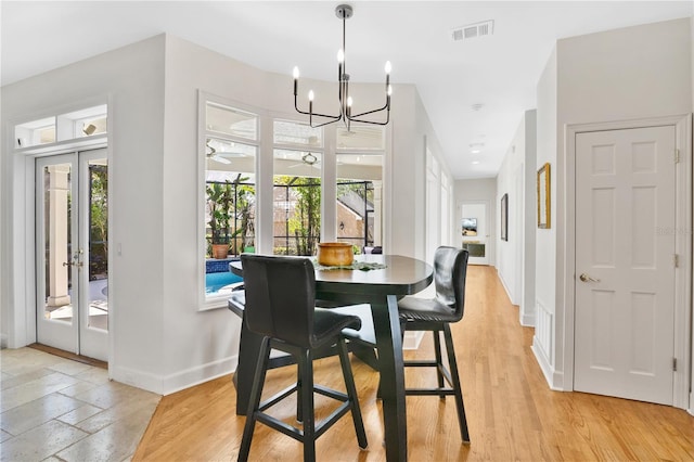 1560 Woodland Ave, Winter Park, FL 32789 - dining room featuring baseboards, visible vents, and a healthy amount of sunlight