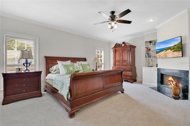 1560 Woodland Ave, Winter Park, FL 32789 - carpeted bedroom featuring ceiling fan, a tile fireplace, and ornamental molding