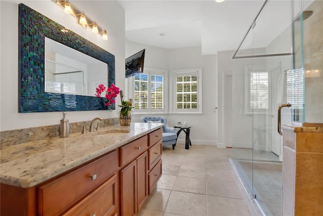 1560 Woodland Ave, Winter Park, FL 32789 - full bath with a stall shower, baseboards, vanity, and tile patterned floors