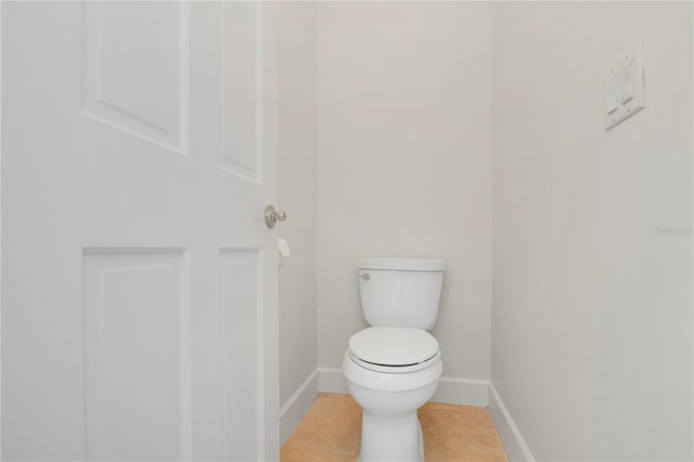 1560 Woodland Ave, Winter Park, FL 32789 - bathroom featuring tile patterned floors, toilet, and baseboards