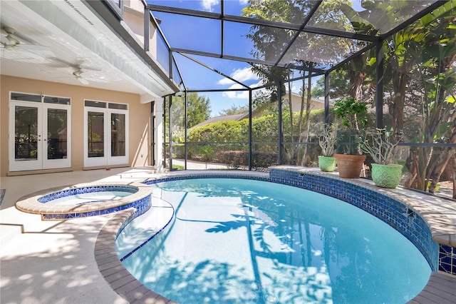 1560 Woodland Ave, Winter Park, FL 32789 - view of swimming pool featuring a patio, french doors, glass enclosure, a ceiling fan, and a pool with connected hot tub