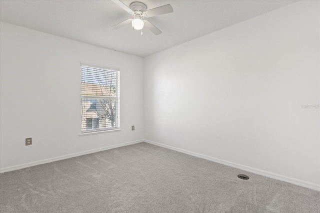 2741 Merrieweather Ln, Kissimmee, FL 34743 - unfurnished room with baseboards, ceiling fan, and carpet