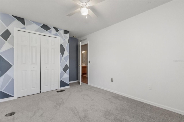 2741 Merrieweather Ln, Kissimmee, FL 34743 - unfurnished bedroom featuring baseboards, carpet flooring, visible vents, and a closet