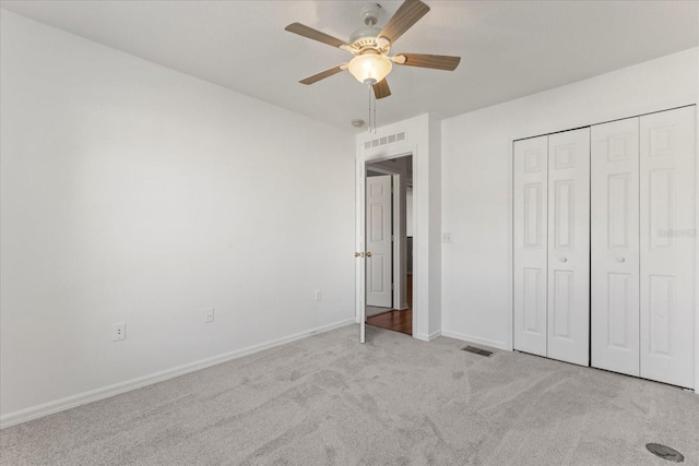 2741 Merrieweather Ln, Kissimmee, FL 34743 - unfurnished bedroom with baseboards, visible vents, a closet, and carpet flooring