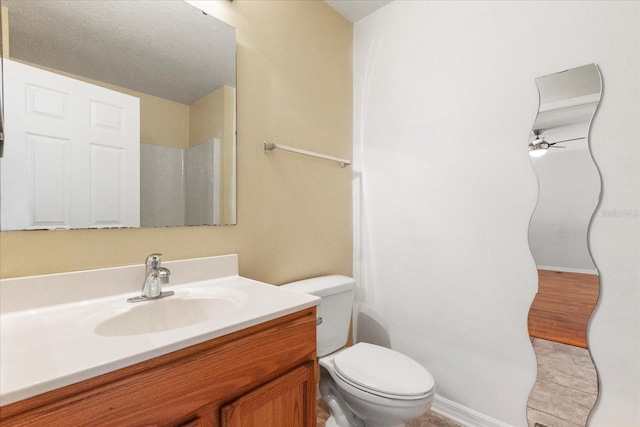 2741 Merrieweather Ln, Kissimmee, FL 34743 - bathroom with baseboards, toilet, and vanity