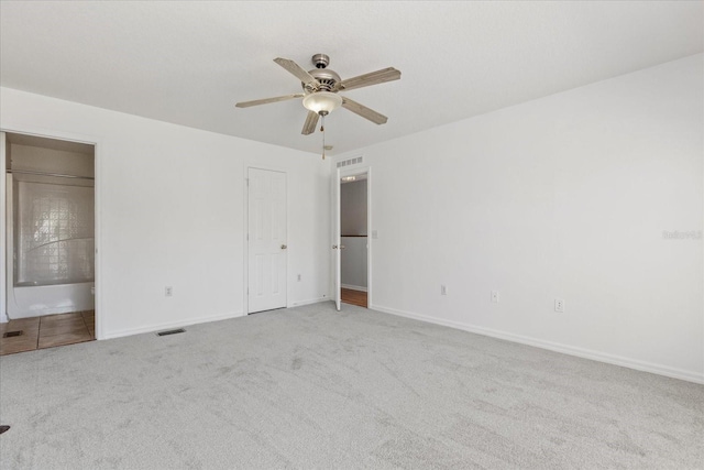 2741 Merrieweather Ln, Kissimmee, FL 34743 - unfurnished bedroom featuring baseboards, a ceiling fan, visible vents, and carpet