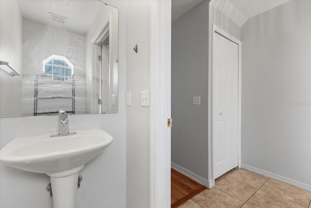 2741 Merrieweather Ln, Kissimmee, FL 34743 - bathroom with baseboards, visible vents, and tile patterned flooring