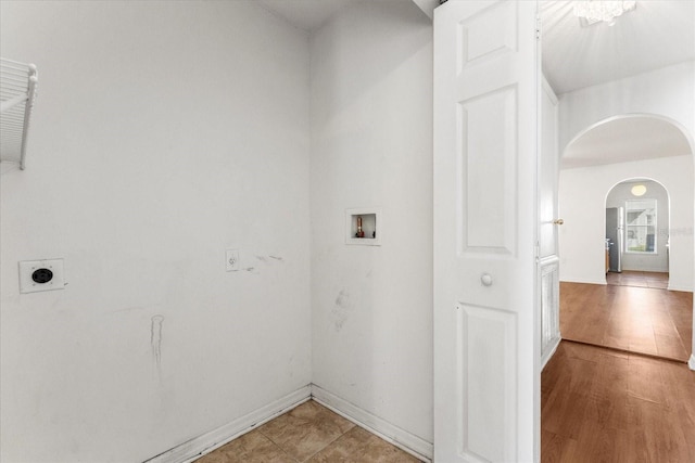2741 Merrieweather Ln, Kissimmee, FL 34743 - washroom with washer hookup, hookup for an electric dryer, laundry area, baseboards, and arched walkways