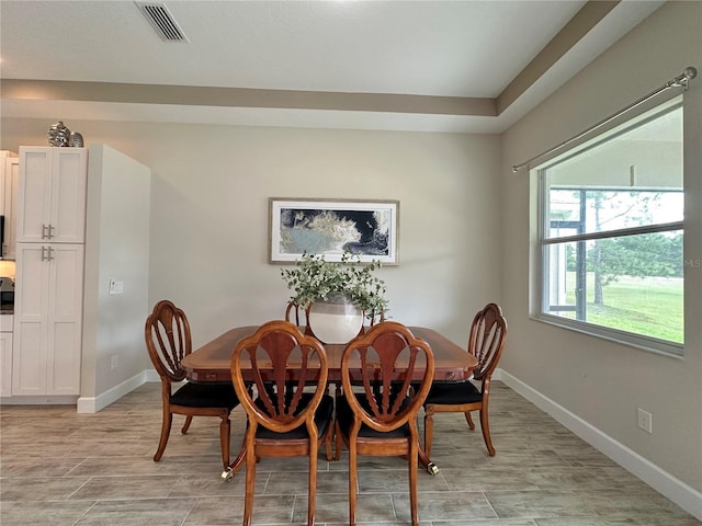 dining area featuring baseboards and visible vents