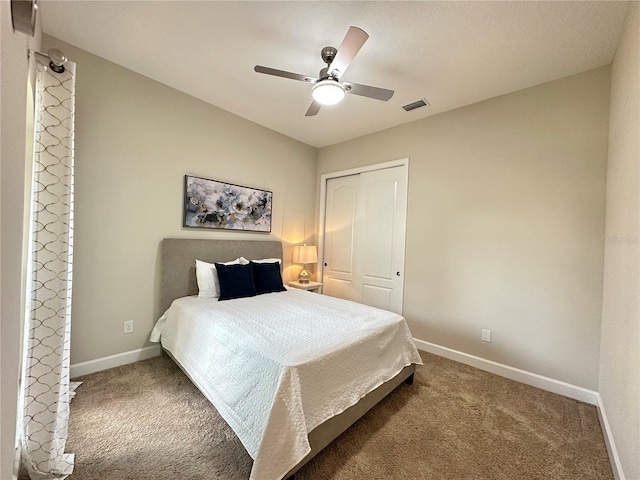 bedroom featuring baseboards, a ceiling fan, carpet flooring, and visible vents