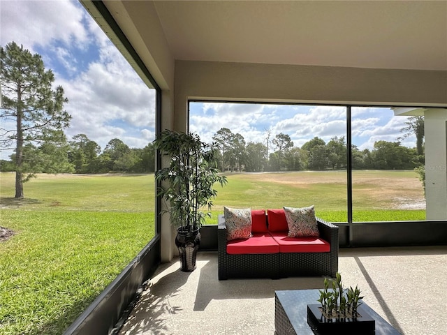 sunroom featuring outdoor lounge area