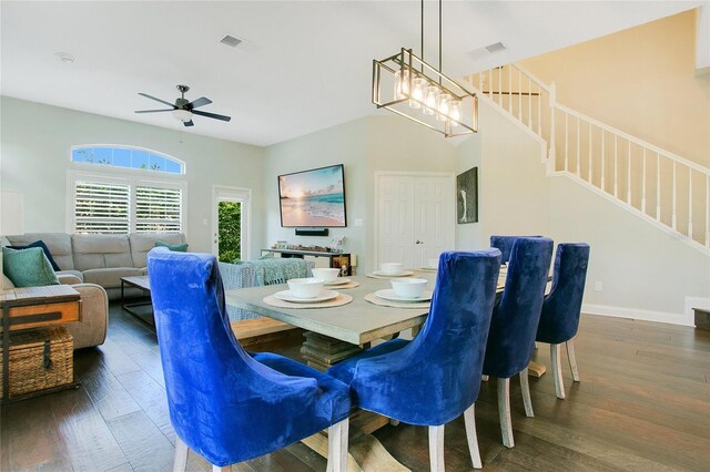 7003 Somerton Blvd, Orlando, FL 32819 - dining area featuring visible vents, a ceiling fan, wood finished floors, and stairs