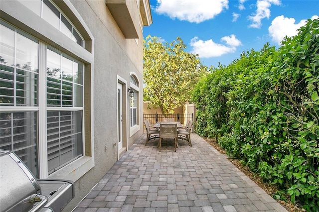 7003 Somerton Blvd, Orlando, FL 32819 - view of patio with fence and outdoor dining area