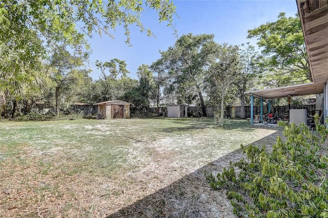 243 W Martin St, Apopka, FL 32712 - view of yard featuring a patio area, a storage shed, an outdoor structure, and fence