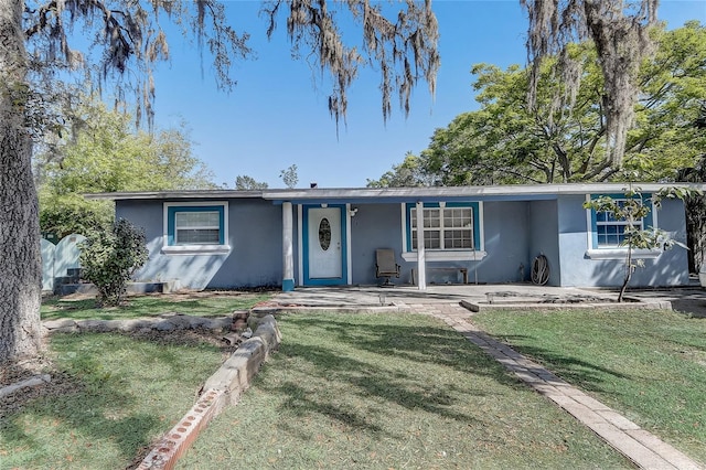 243 W Martin St, Apopka, FL 32712 - single story home featuring stucco siding and a front lawn