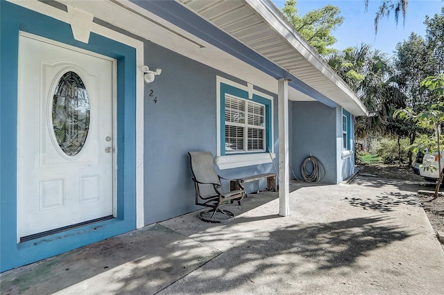 243 W Martin St, Apopka, FL 32712 - property entrance with stucco siding