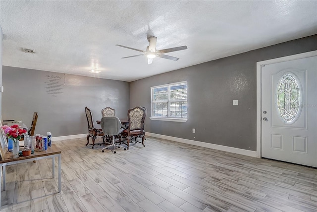 243 W Martin St, Apopka, FL 32712 - dining room with ceiling fan, wood finished floors, and a textured ceiling