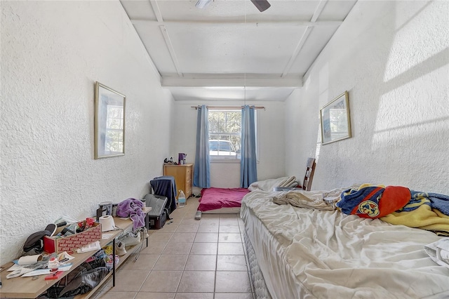 243 W Martin St, Apopka, FL 32712 - bedroom with light tile patterned floors, ceiling fan, and a textured wall