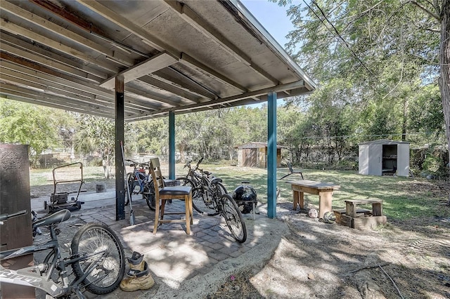 243 W Martin St, Apopka, FL 32712 - view of patio with a storage shed, fence, and an outbuilding