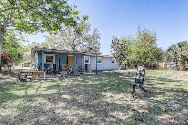 243 W Martin St, Apopka, FL 32712 - rear view of property featuring stucco siding, cooling unit, fence, and a lawn