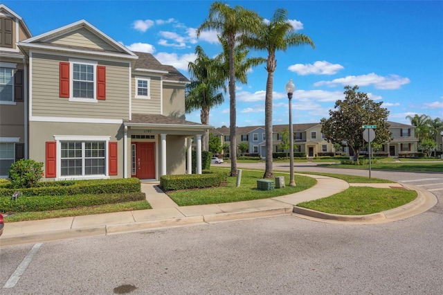 1197 Tallow Rd, Apopka, FL 32703 - multi unit property with stucco siding, a front lawn, a shingled roof, and a residential view