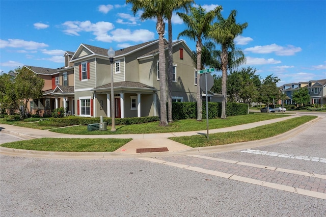 1197 Tallow Rd, Apopka, FL 32703 - view of front facade featuring a residential view, stucco siding, and a front yard