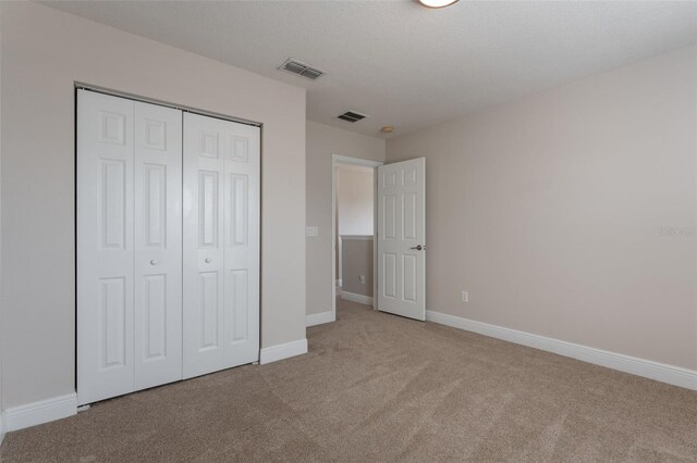 1197 Tallow Rd, Apopka, FL 32703 - unfurnished bedroom featuring carpet floors, baseboards, and a closet