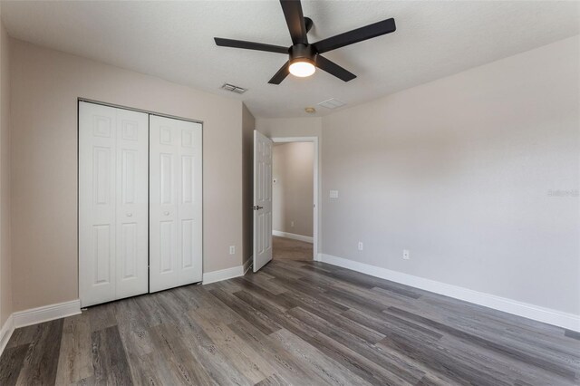 1197 Tallow Rd, Apopka, FL 32703 - unfurnished bedroom with wood finished floors, a closet, baseboards, and ceiling fan