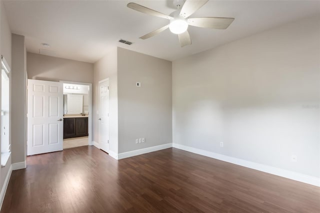 1197 Tallow Rd, Apopka, FL 32703 - empty room featuring baseboards, dark wood-type flooring, and a ceiling fan