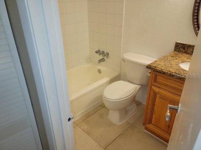 4779 S Texas Ave Unit 4779C, Orlando, FL 32839 - bathroom with toilet, tile patterned flooring, vanity, and bathing tub / shower combination