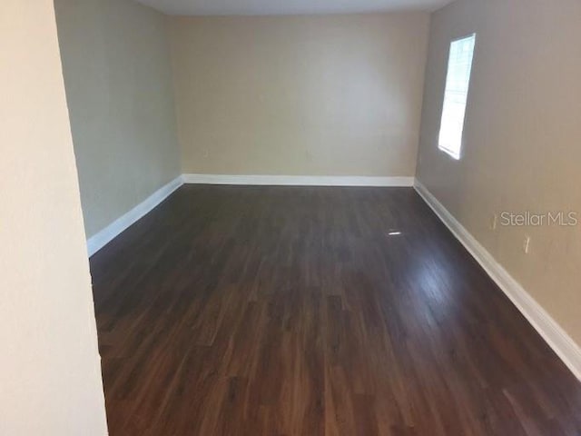 4779 S Texas Ave Unit 4779C, Orlando, FL 32839 - spare room with dark wood finished floors and baseboards