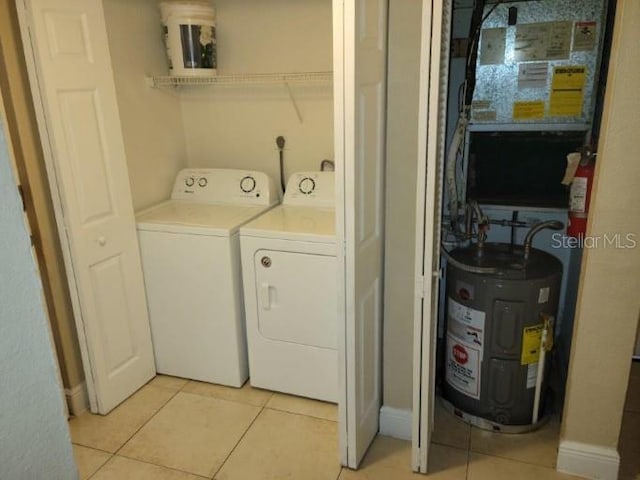 4779 S Texas Ave Unit 4779C, Orlando, FL 32839 - washroom with water heater, separate washer and dryer, light tile patterned flooring, and laundry area