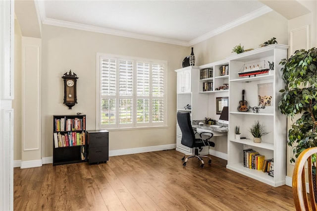 1638 Swallowtail Ln, Sanford, FL 32771 - home office with built in study area, wood finished floors, baseboards, and ornamental molding